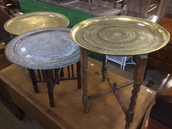 3 circular brass tray tables